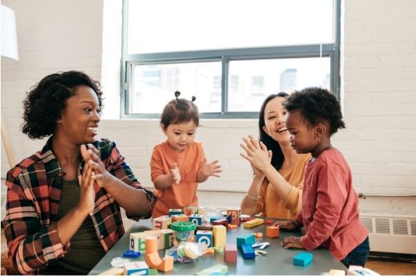 early childhood teachers with students