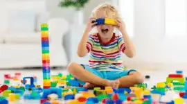 young child playing with blocks