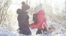 children playing outside in the snow