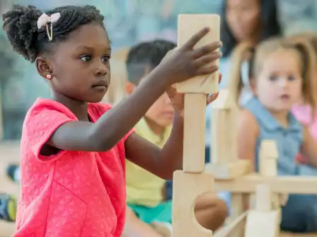young children playing in a classroom