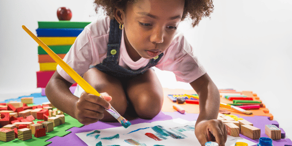 child painting on paper