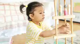 a child playing in a classroom