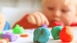 ​​Child exploring dough in open-ended art activity​