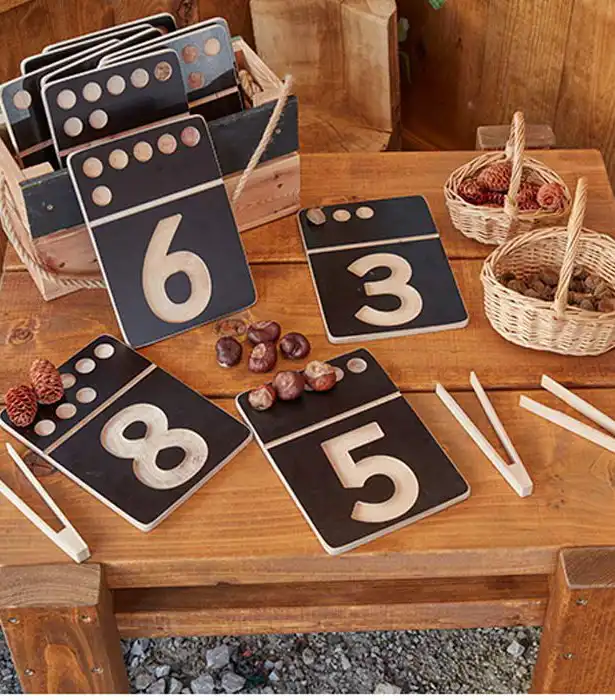 Outdoor table with number signs for hands-on math exploration