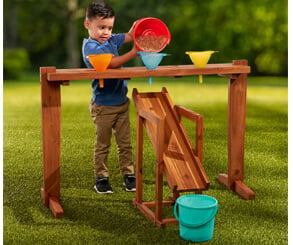 Toddler child standing at family board photos