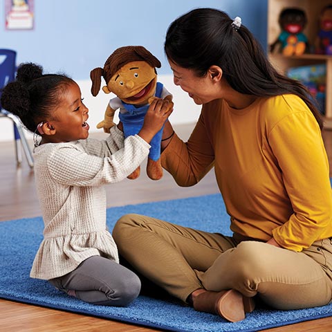 Preschool teacher and child using MVP Kids Puppet