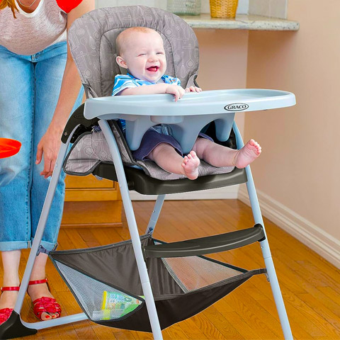 Infant sitting in highchair