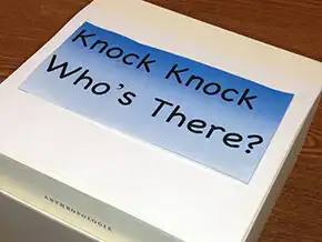 Knock Knock Who's There on a white box