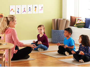 Teacher and students doing yoga