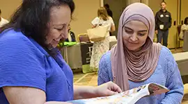 Becker’s Sales Specialist showing catalog and sharing product expertise