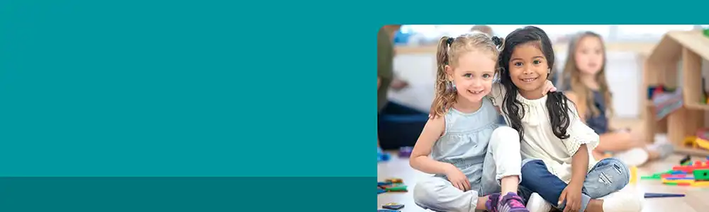 Preschool children sitting on rug together
