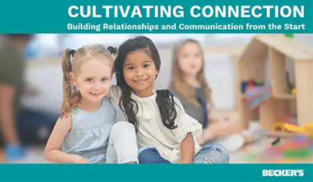 Preschool children sitting on carpet in classroom
