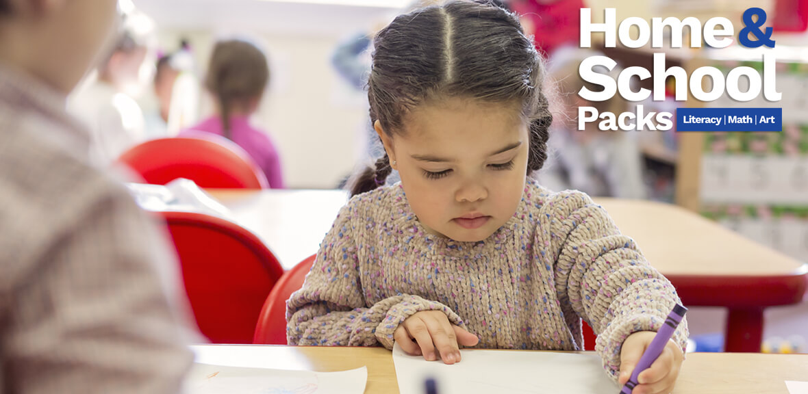 Preschool child sitting at table using crayons from Becker's Students Packs